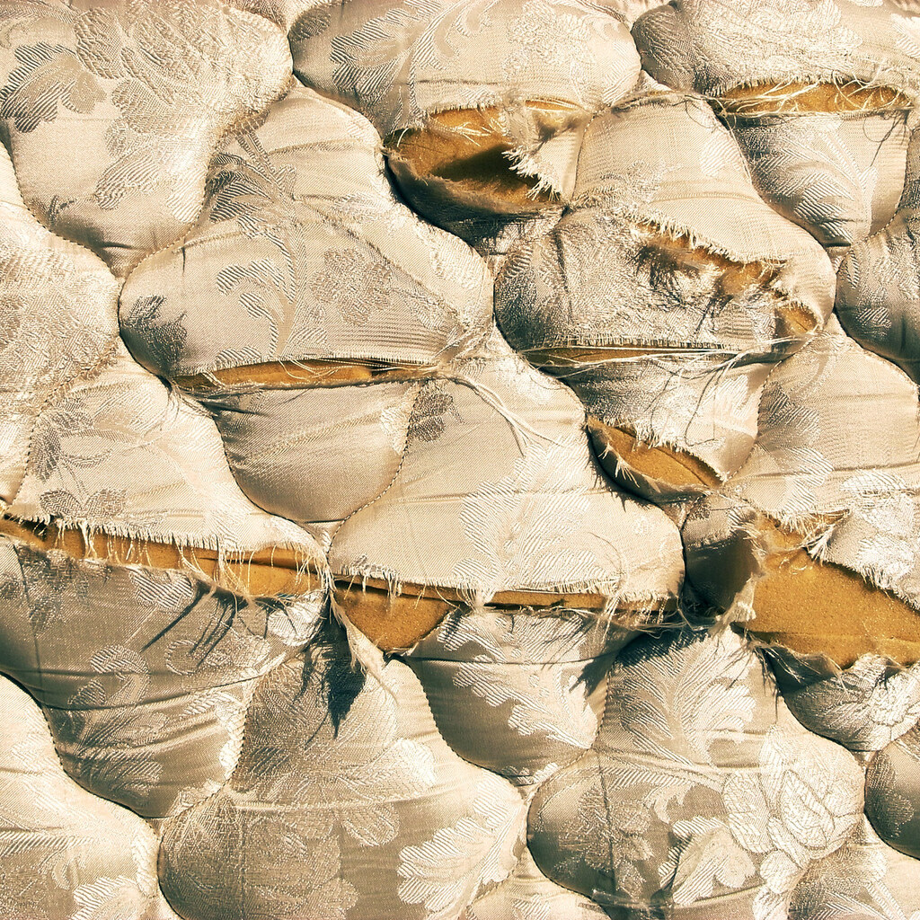 Photo of a torn mattress