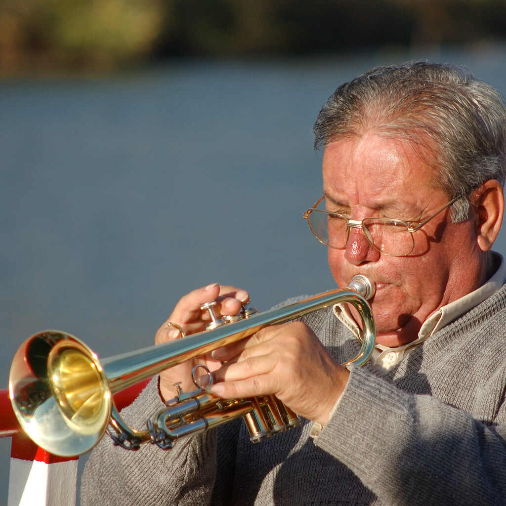 Photo of a man playing a trumpet