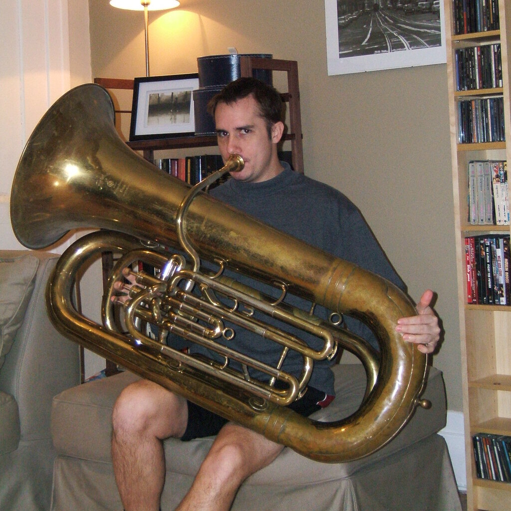 Photo of a man playing a tuba