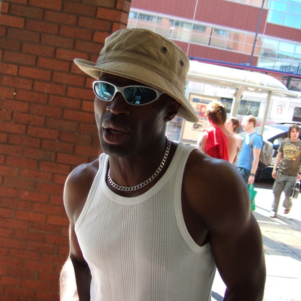 Photo of a man wearing an undershirt