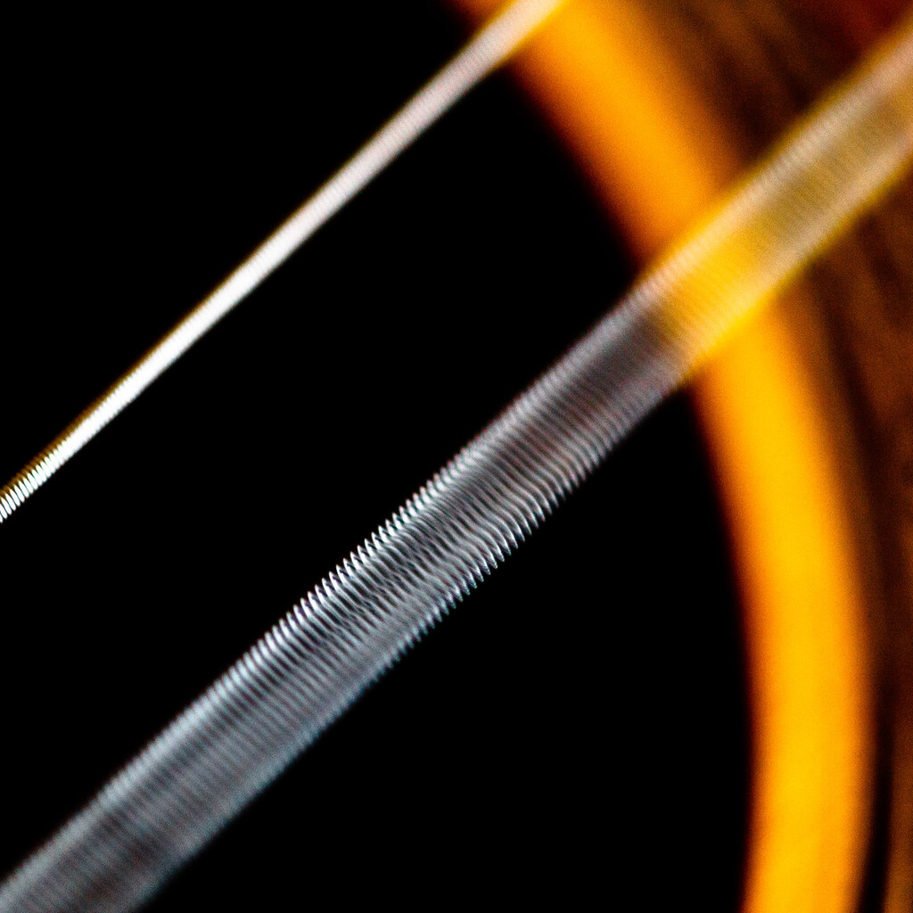 Photo of a vibrating guitar string