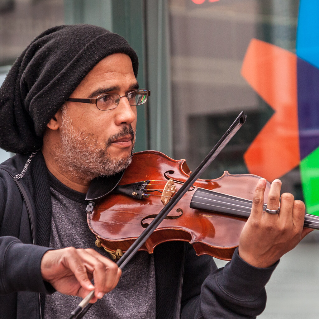 Photo of a man playing a violin