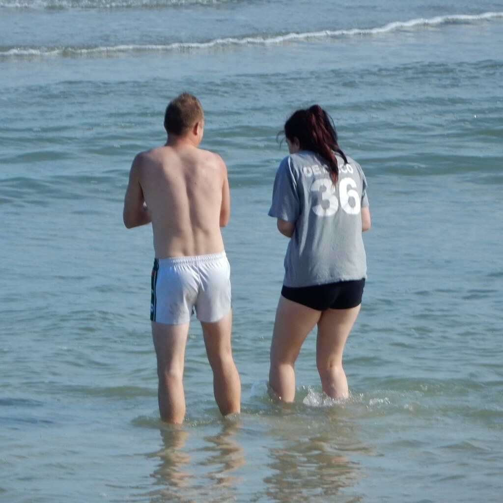 Photo of people wading at the beach