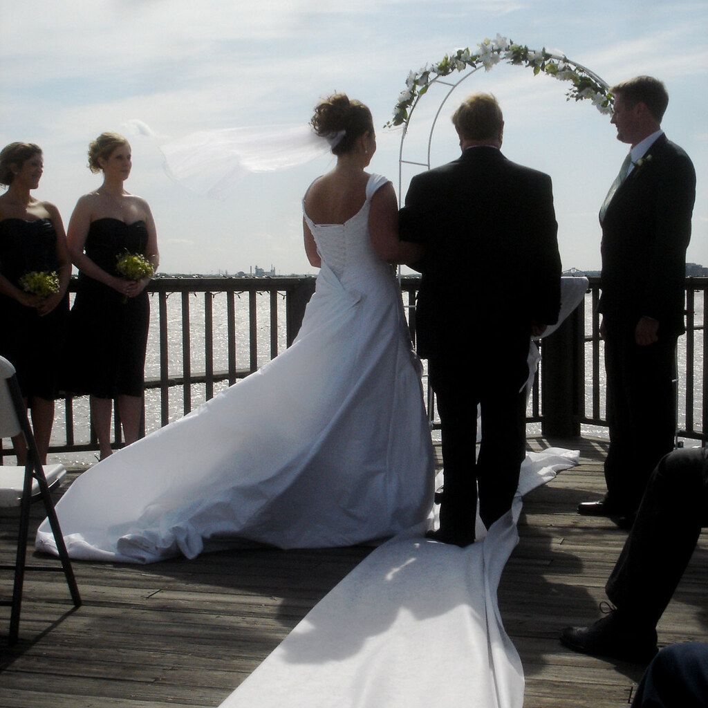 Photo of two people getting married.