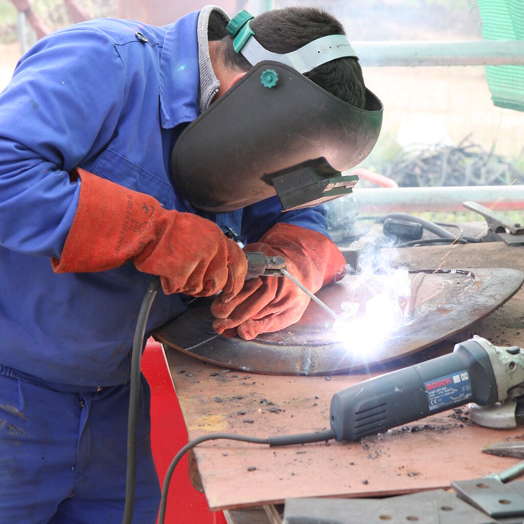 Photo of a man welding.