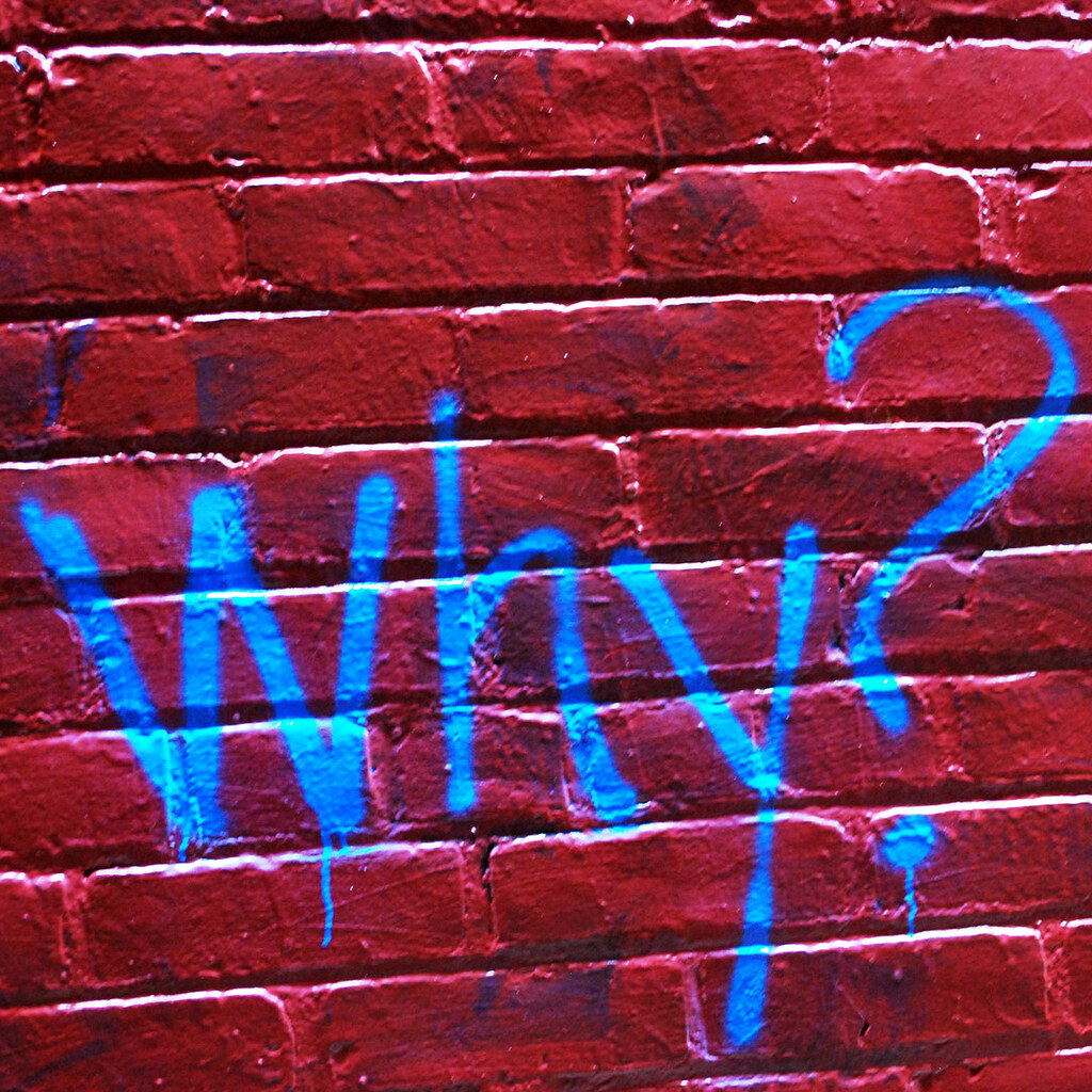 Photo of the word why in graffiti