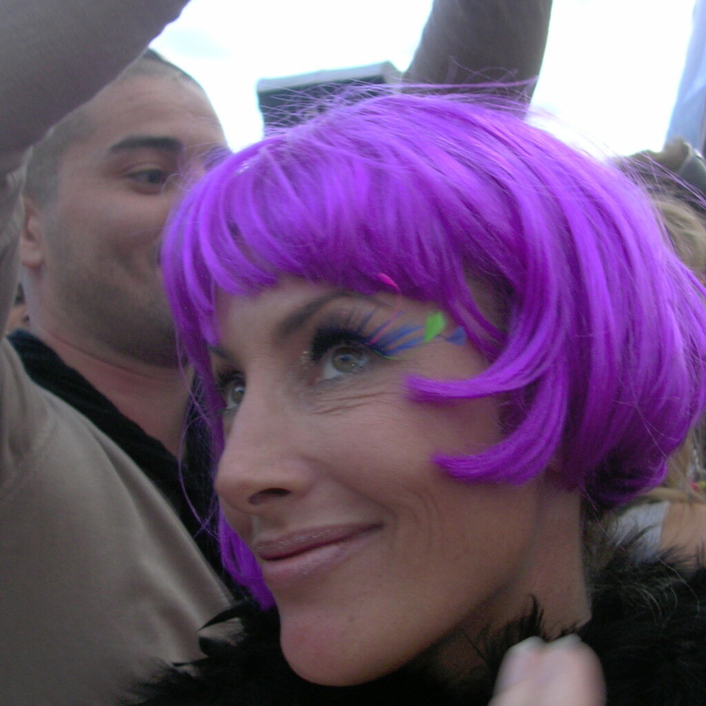 Photo of a woman wearing a purple wig