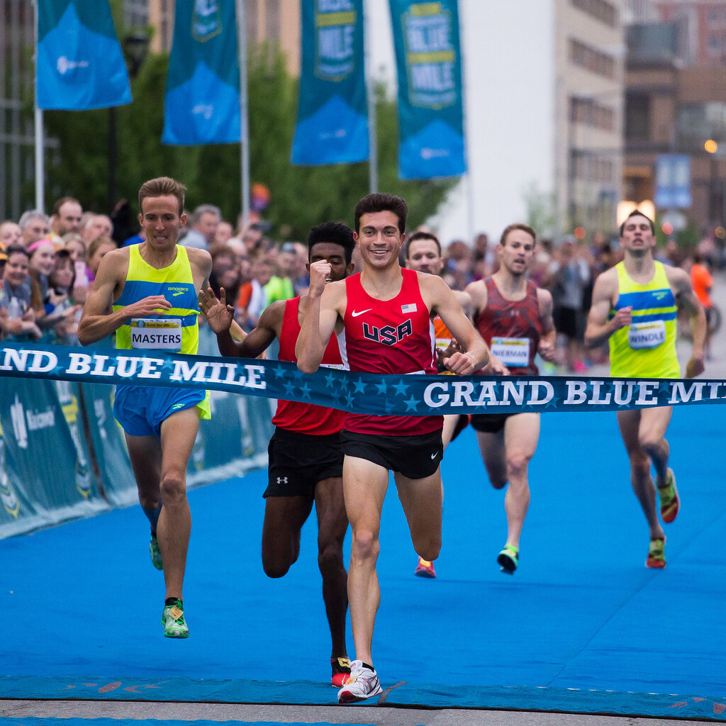 Photo of a runner winning a race